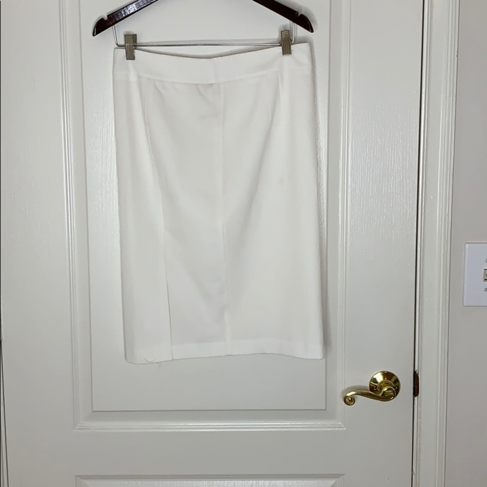 White knee length skirt.